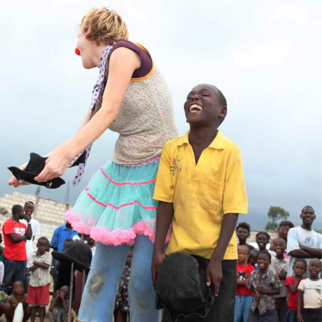 Clown and a kid performing