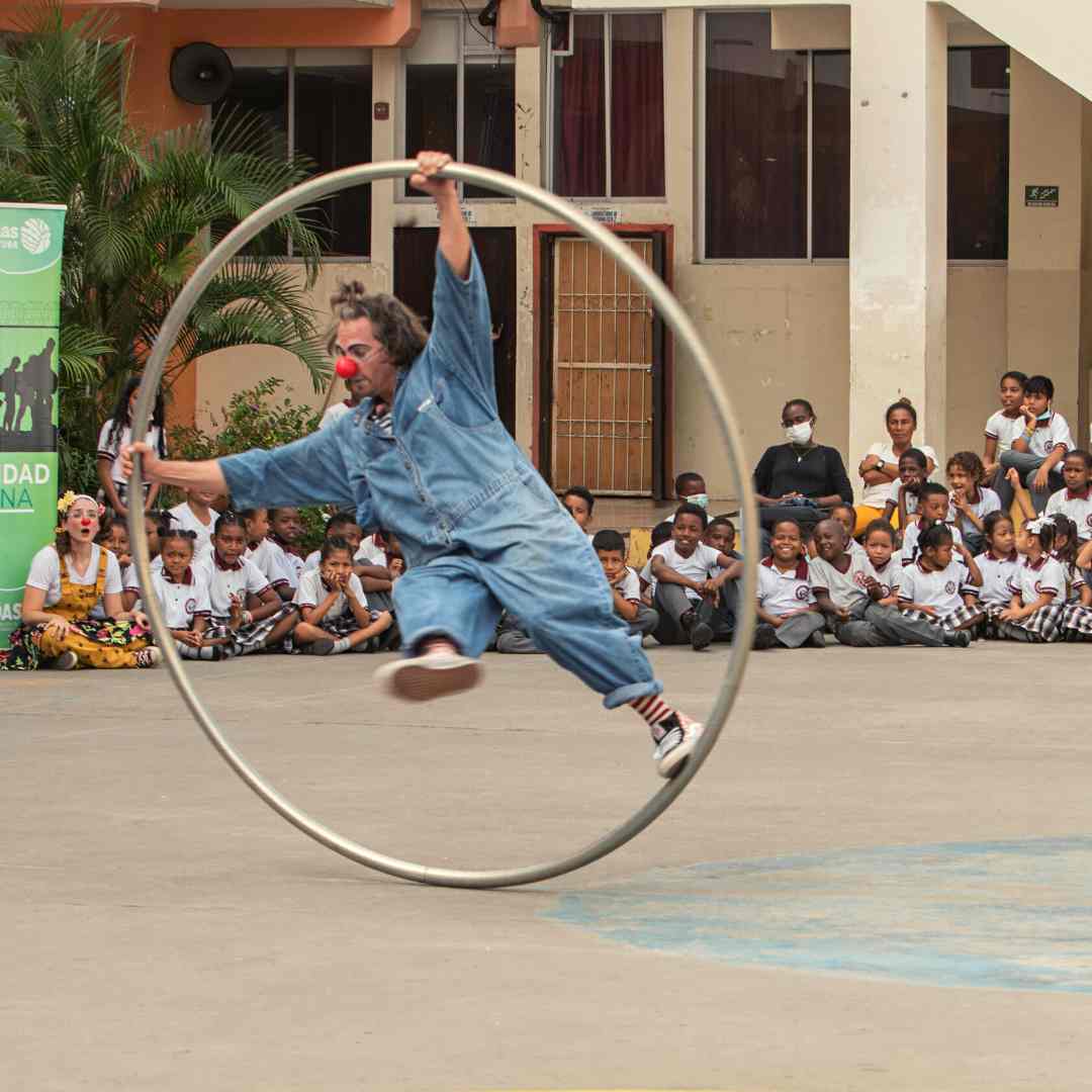 Clown riding a hoop