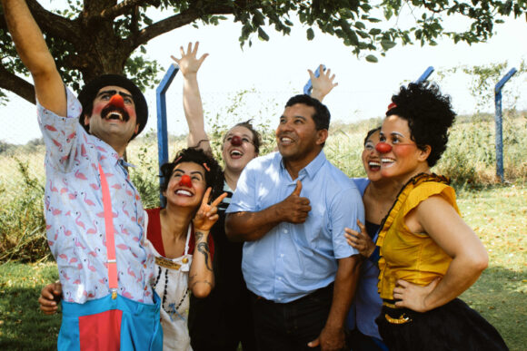 Clowns looking upward for a photo