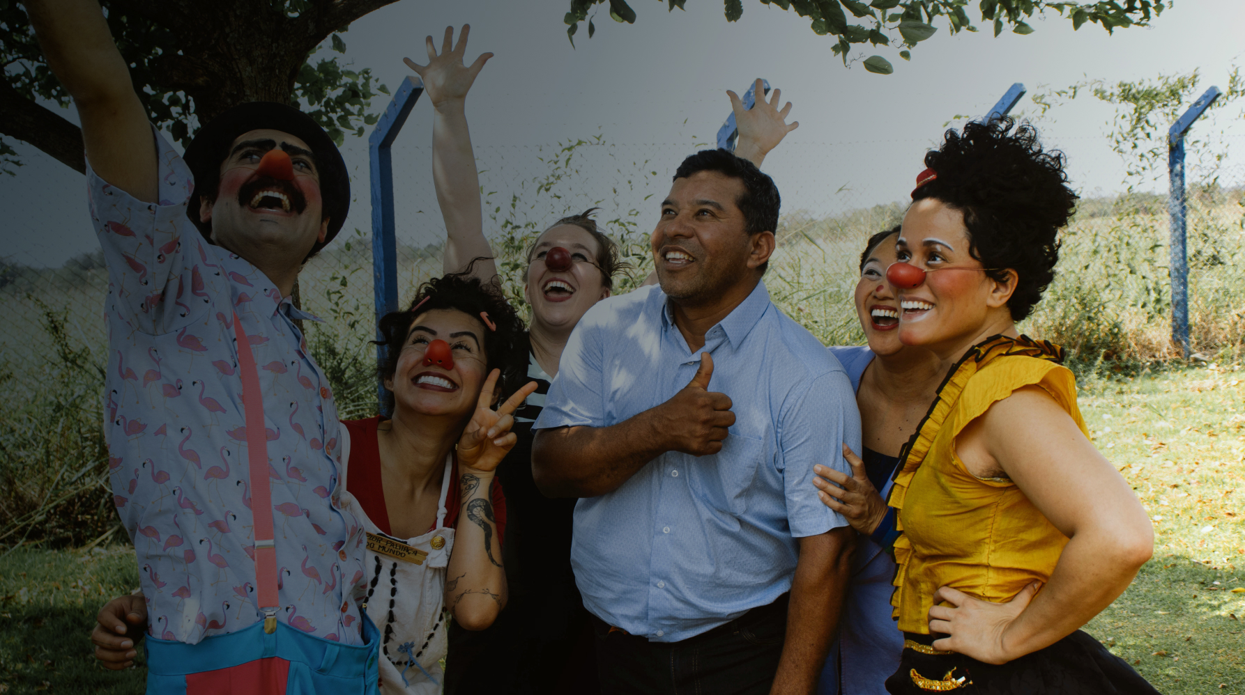 Group of adults posing for camera off screen