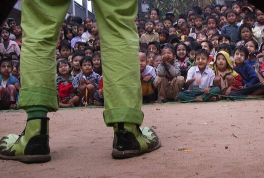 Clown in front of a group of kids