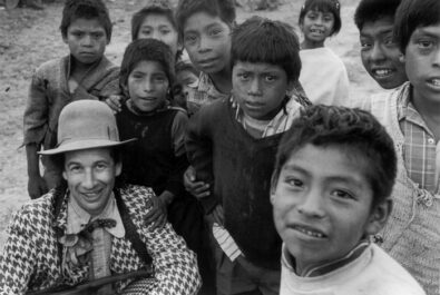 Clown posing with kids for camera