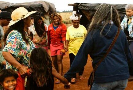 Group of adults and kids holding hands