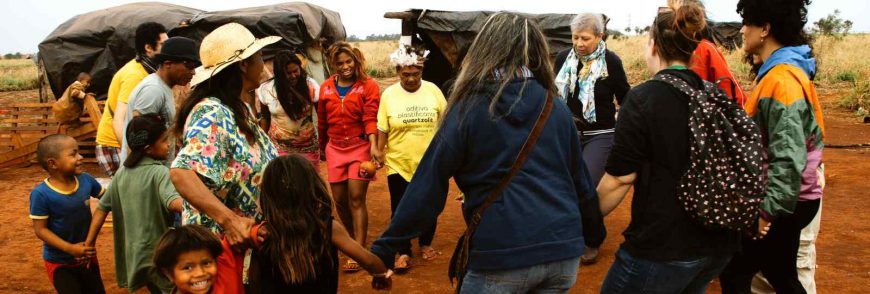 Group holding hands and forming a circle