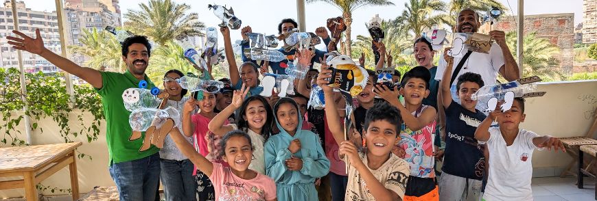 Kids in Cairo showing off their puppets