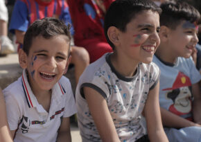 Kids with face paint smiling