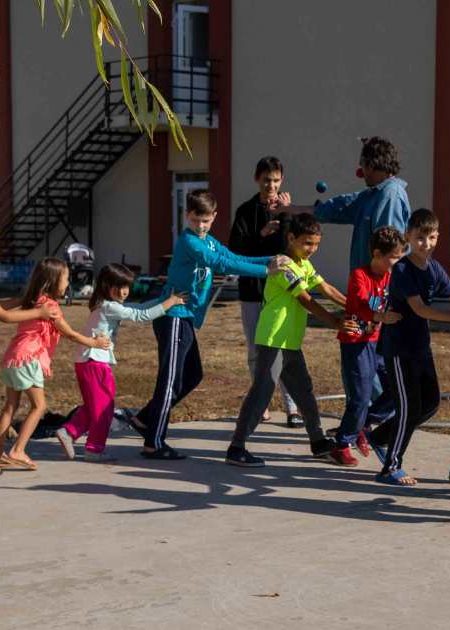 Kids and adults forming a conga line