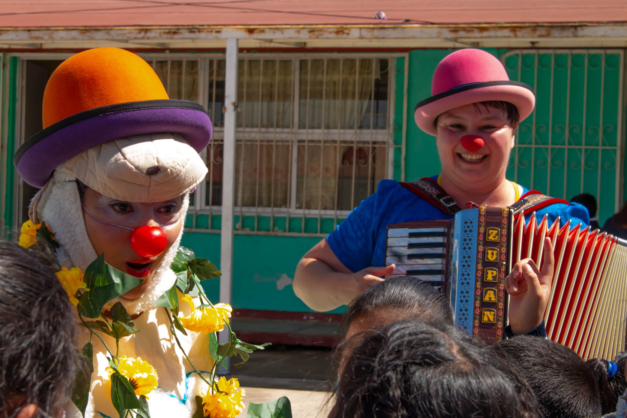 Clowns with kids smiling