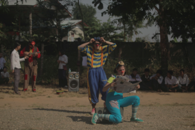 Clown with newspaper